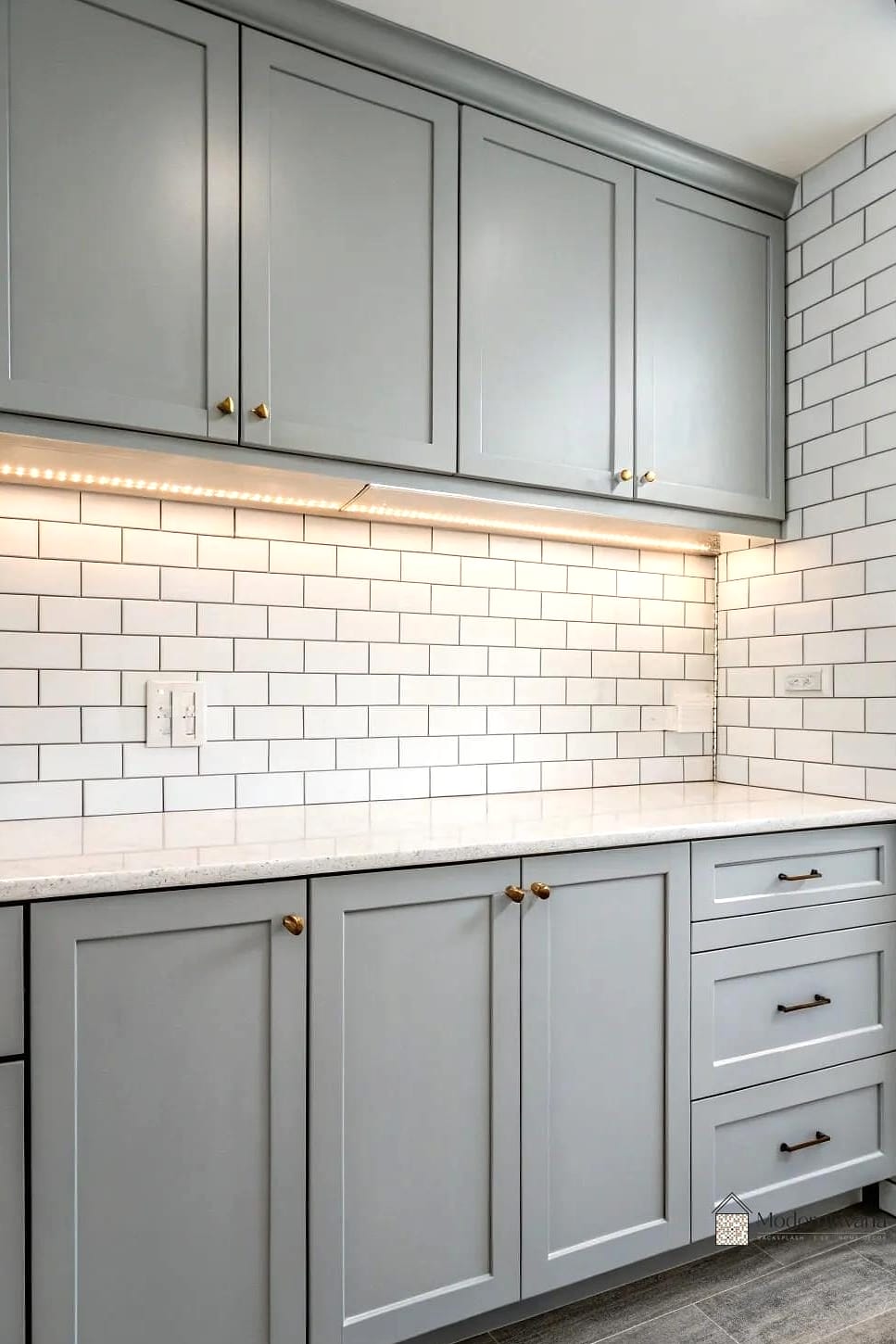 Gray Cabinets with Vertical Tile Installation