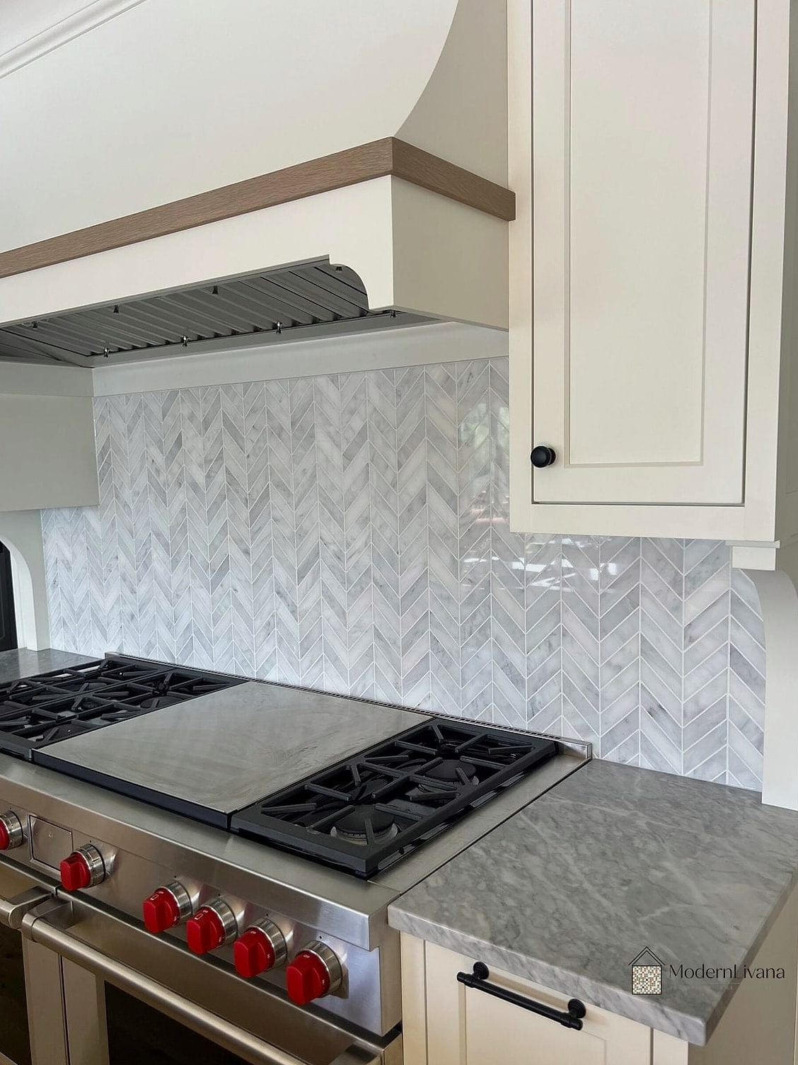 Marble Chevron Backsplash Behind a Range Hood