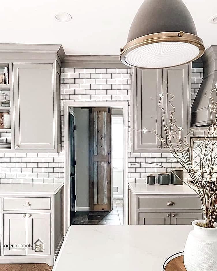 Soft Gray Shaker Cabinets with White Countertops