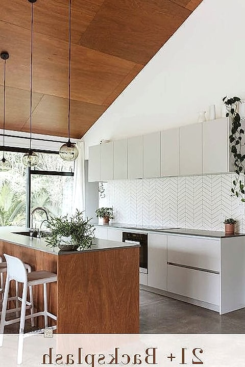 22 White Chevron Backsplash Ideas That Maximize Style and Function 15 14. White Chevron Accent Wall Behind a Range