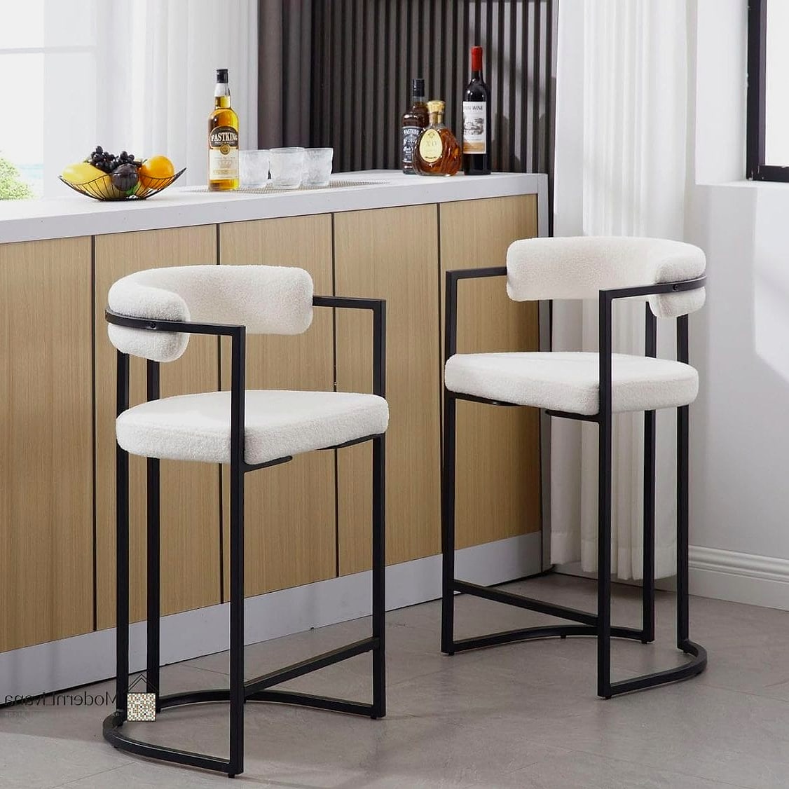 Black Bar Stools at a White Island