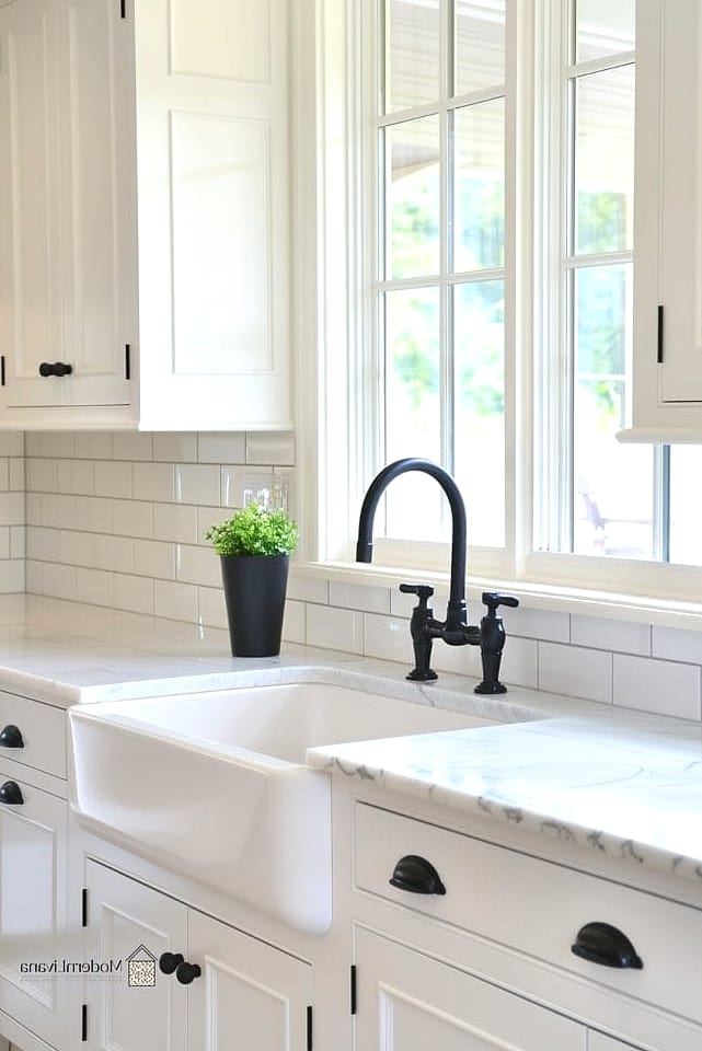 Black Faucet and Cabinet Pulls with White Subway Tile