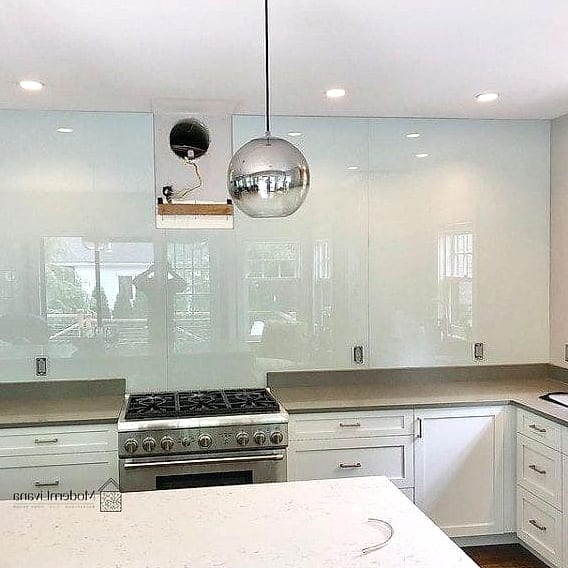 Glass Backsplash Behind Open Shelving