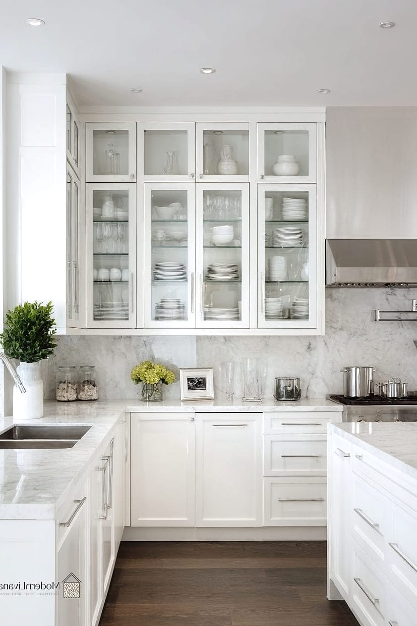 23 White Modern Kitchen Ideas Worth Bookmarking Before You Renovate 13 Glass-Front Upper Cabinets