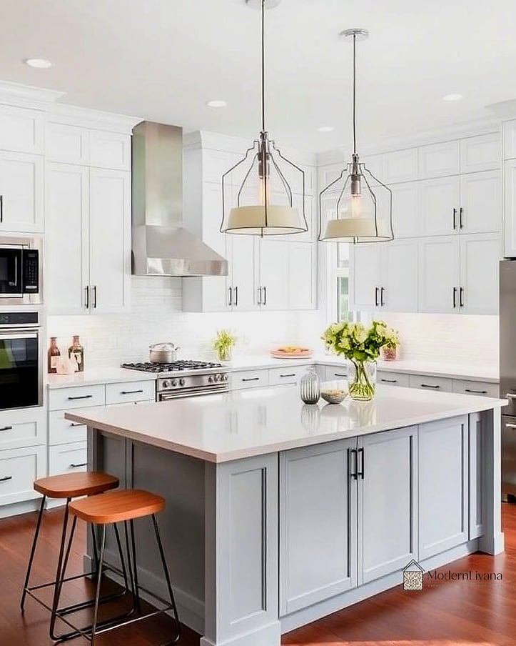 23 Gray and White Kitchen Ideas You'll Want to Save Right Now 22 Gray Kitchen Island with Pendant Lighting