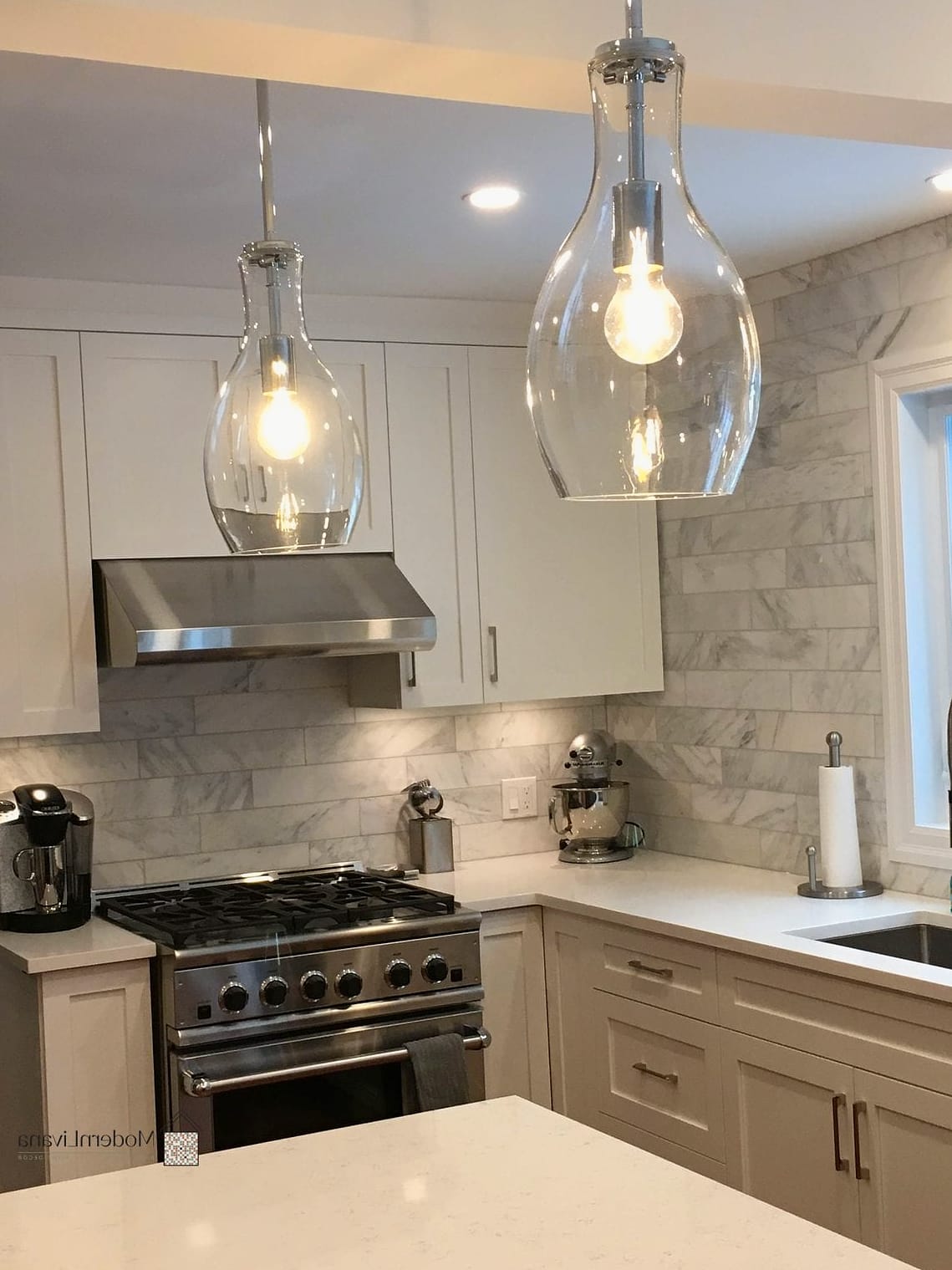 Gray Pendant Lights Over a White Island