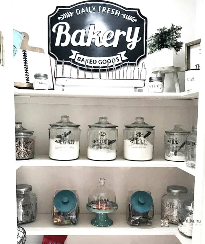 Labeled Glass Jars on White Shelves