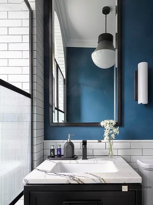 Matte Black Fixtures Against Blue Walls