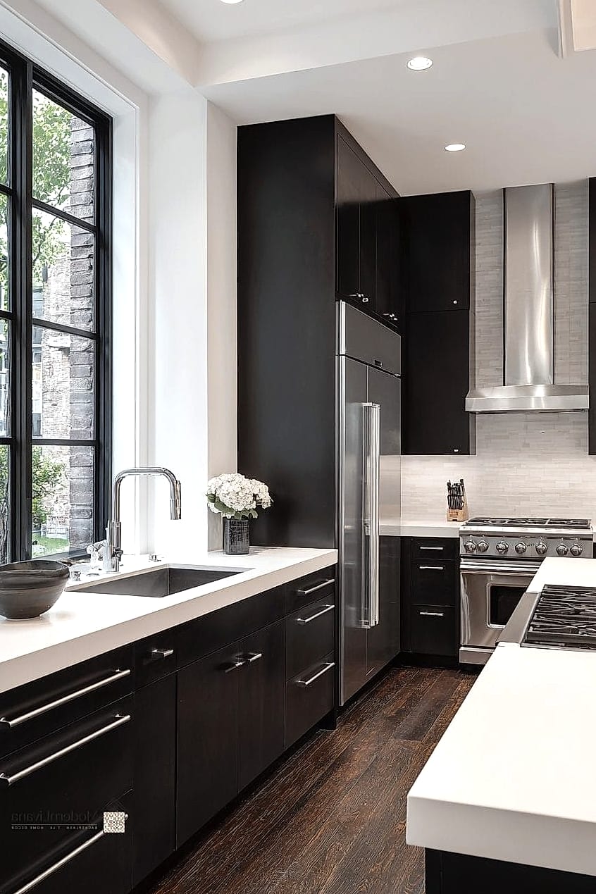 10 Modern White Kitchen Ideas You'll Want to Save Right Now 9 Matte Black Faucet with White Farmhouse Sink