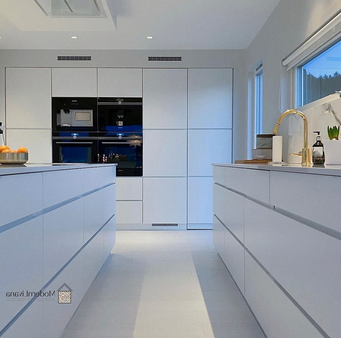 30 White Modern Kitchen Ideas Worth Bookmarking Before You Renovate 17 Minimalist White Kitchen with Handleless Cabinets