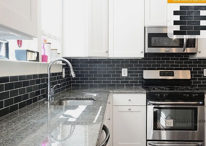 Neutral Travertine with Black Fixtures