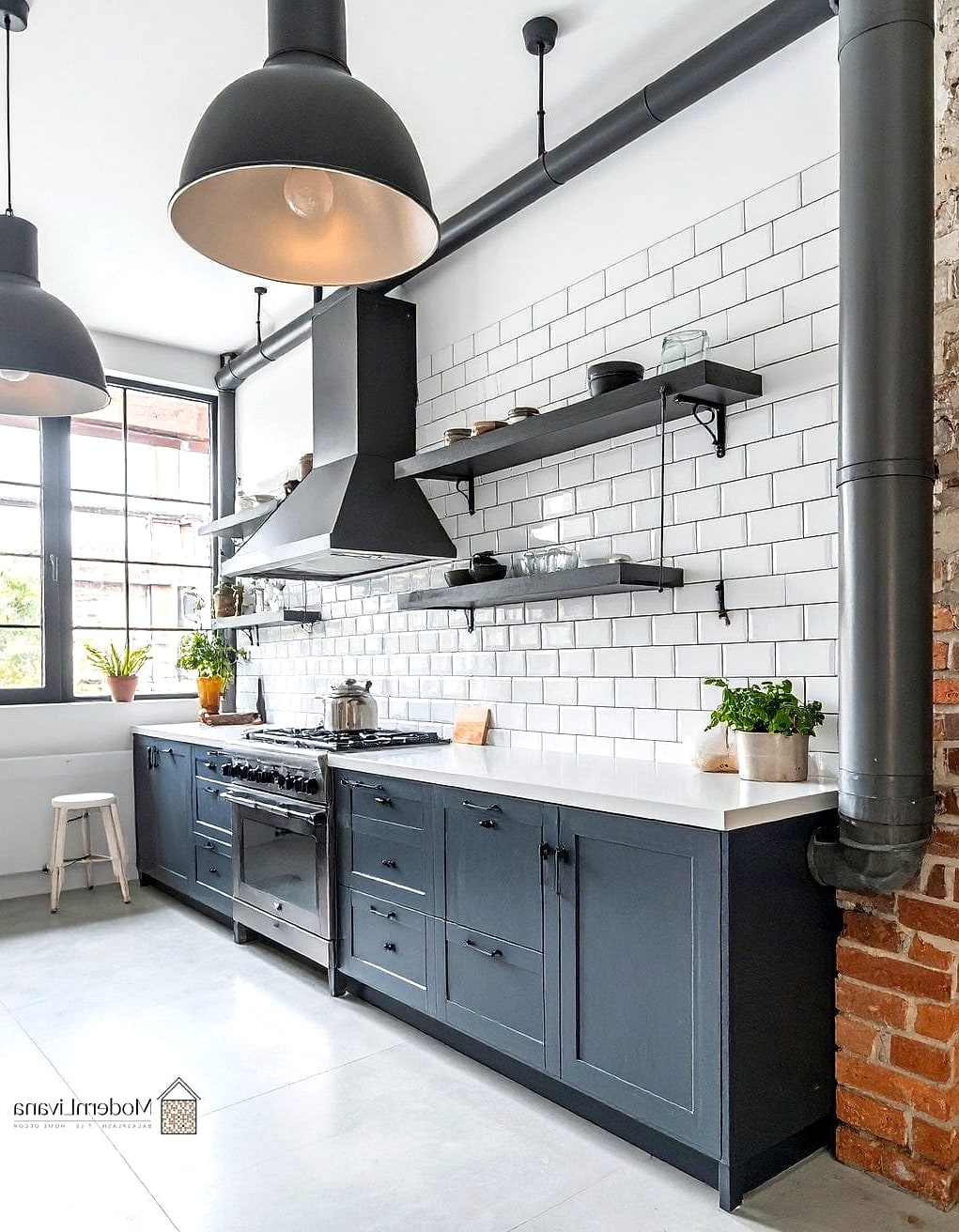 26 Industrial Style Kitchen Ideas From Homes We Absolutely Love 14 Subway Tile Backsplash in a Herringbone Pattern