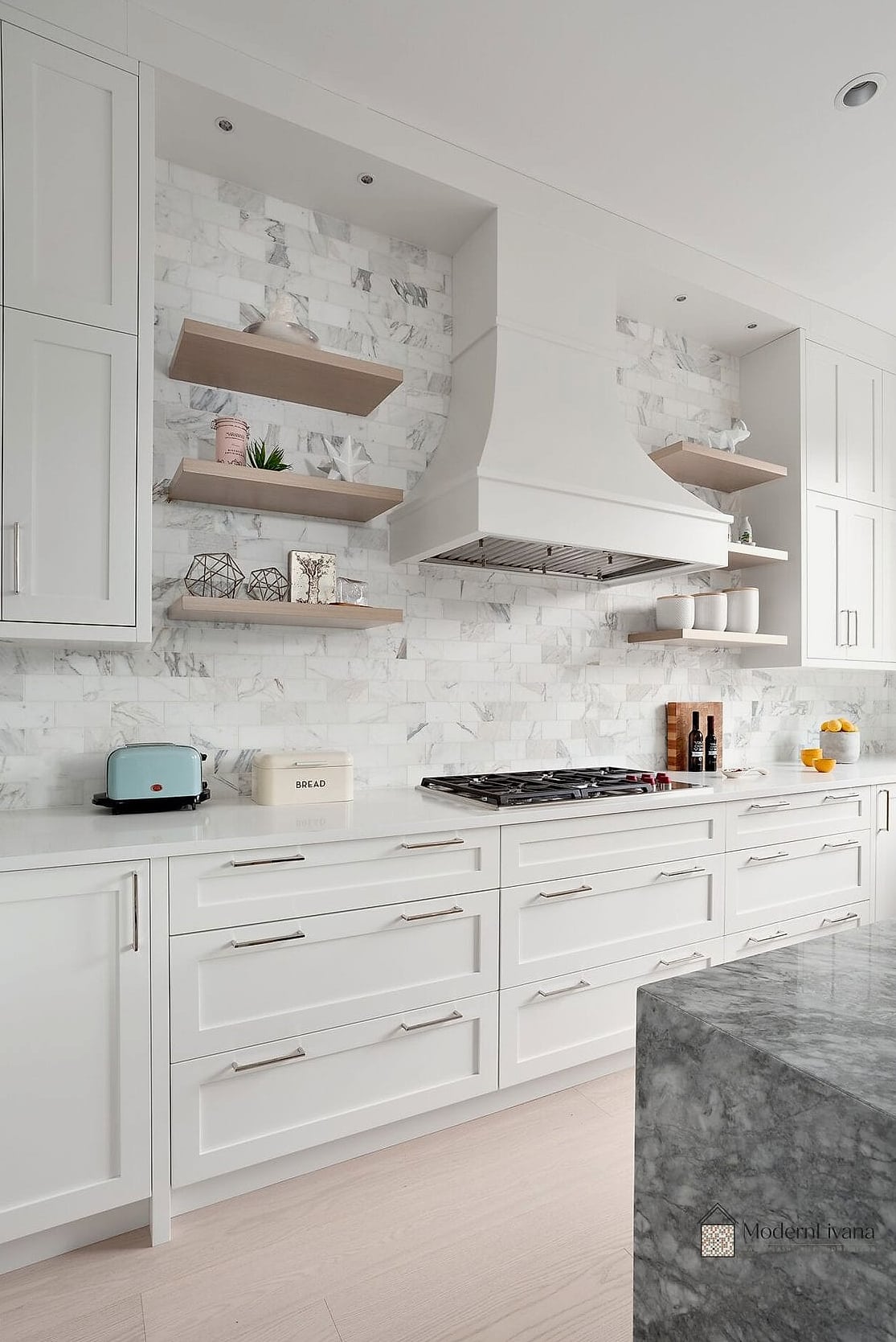 White Cabinets with a Marble Backsplash