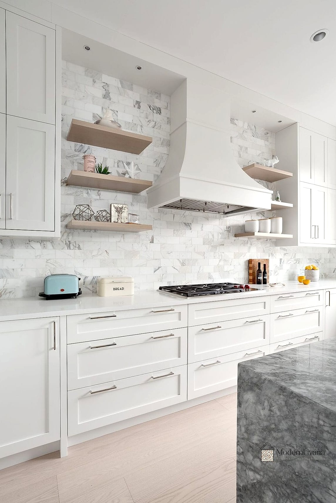 26 White Cabinets Ideas That Look Expensive But Aren't 9 White Cabinets Paired with a Marble-Look Backsplash
