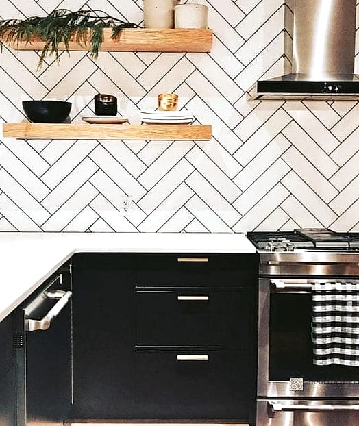 White Cabinets with Black Herringbone Backsplash Tile