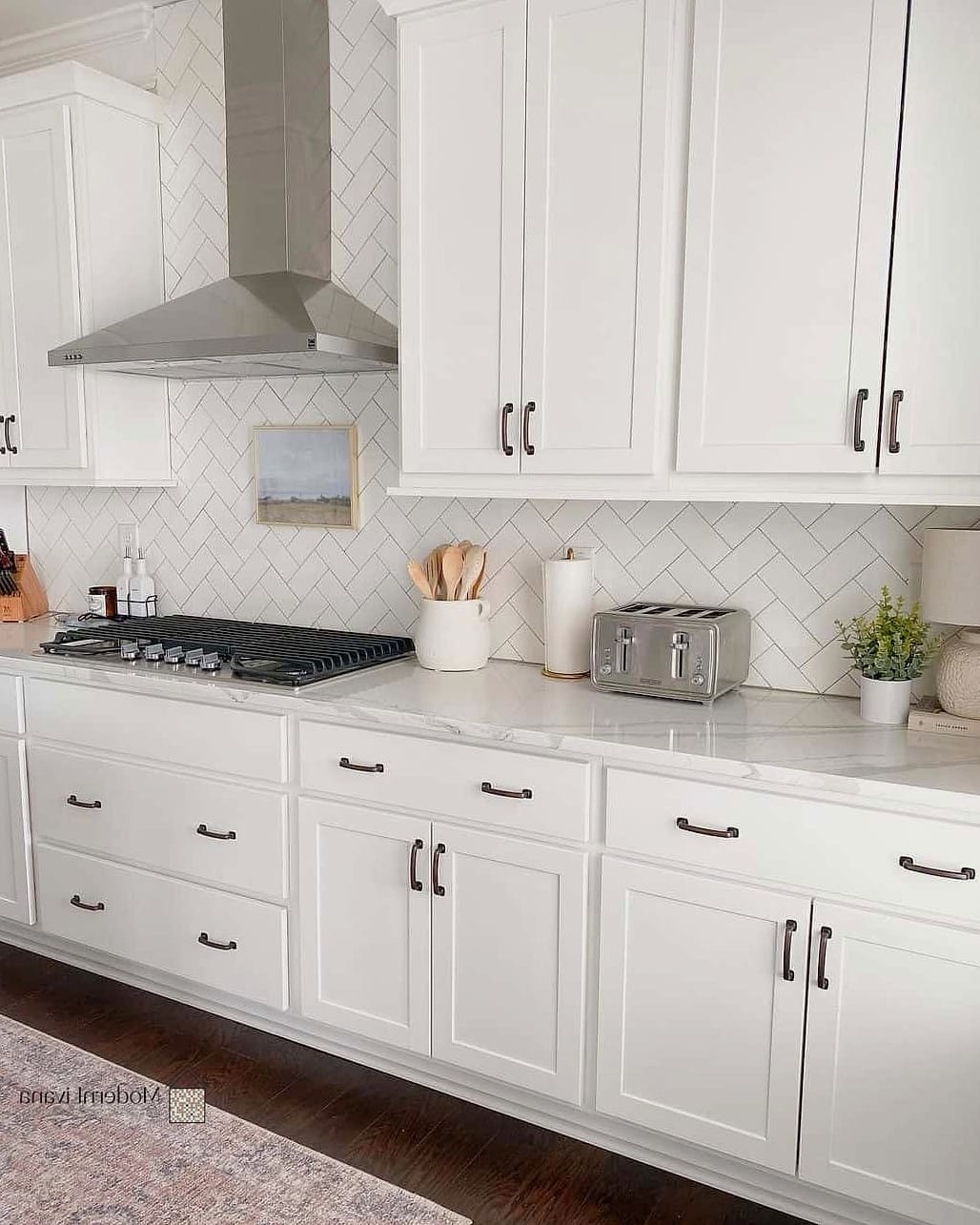 White Cabinets with Herringbone Tile Backsplash