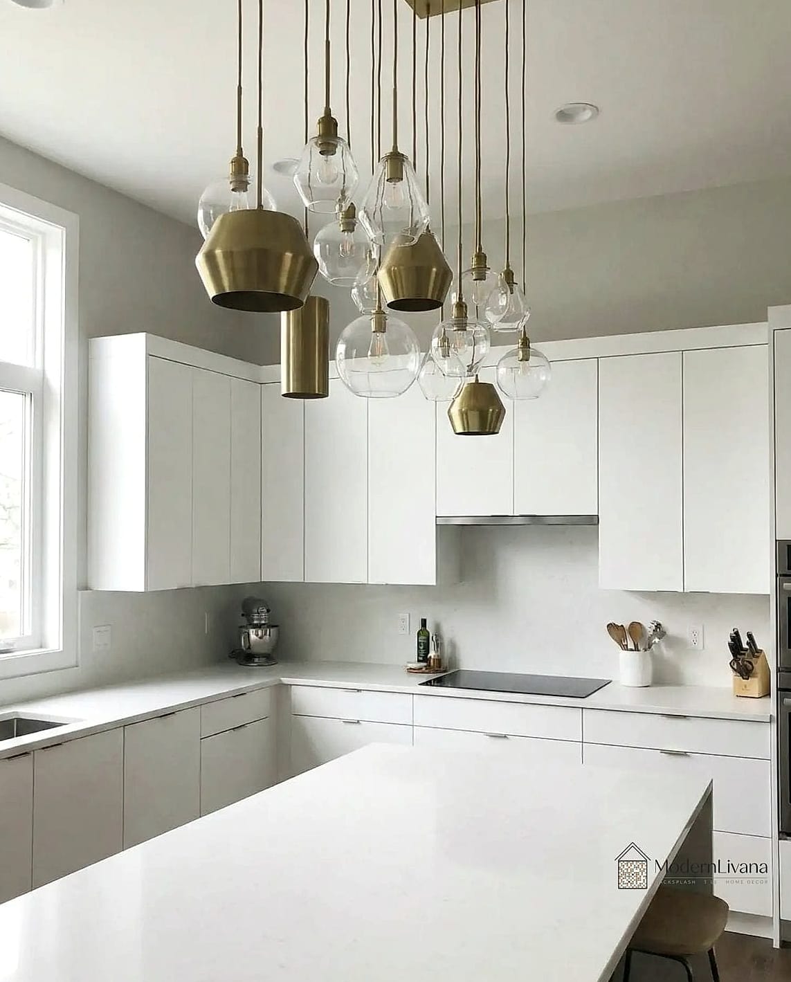 30 White Cabinets Ideas Perfect for Any Budget 26 White Cabinets with Statement Lighting