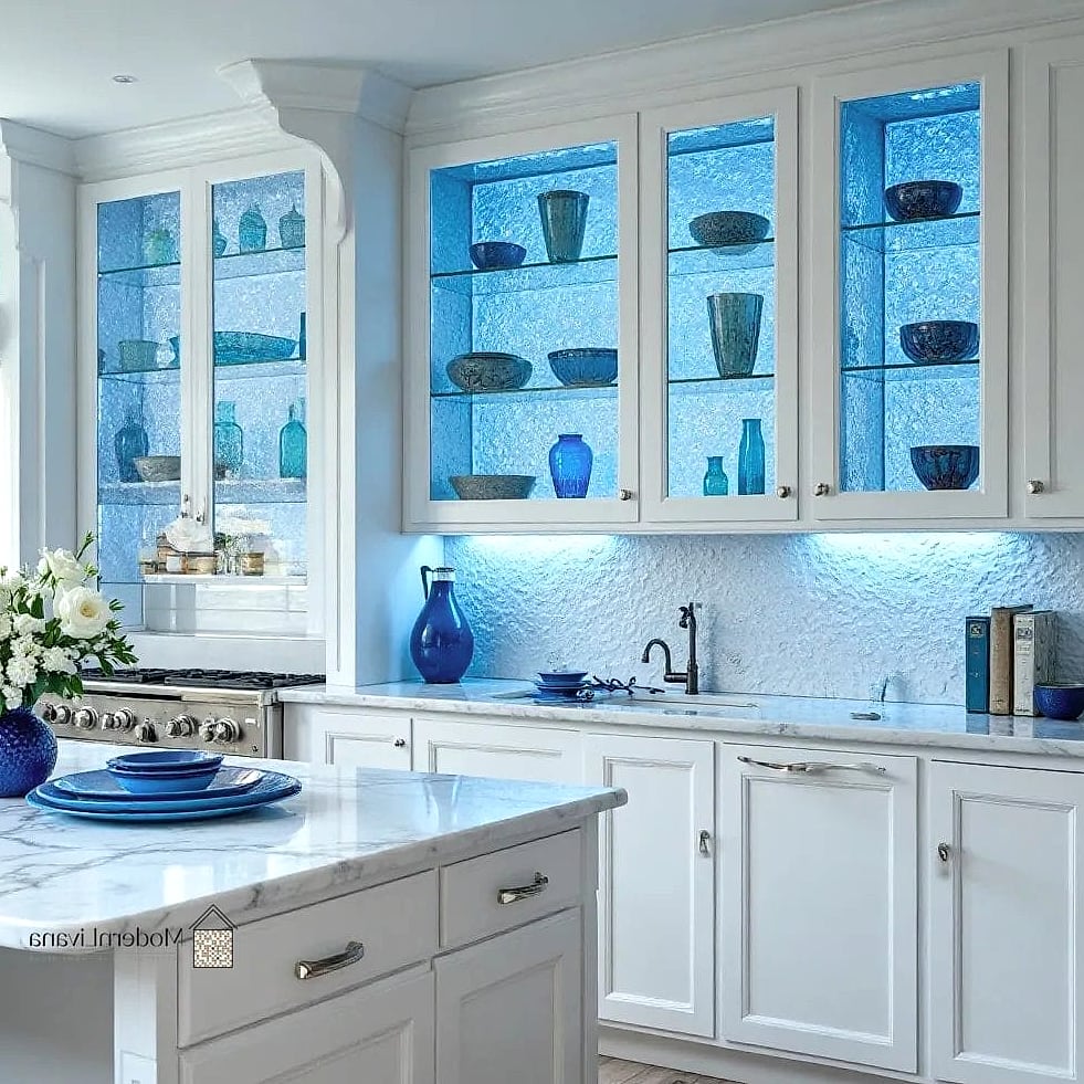 23 Blue and White Kitchen Ideas to Show Your Contractor 19 White Kitchen with Blue Glass Cabinet Doors