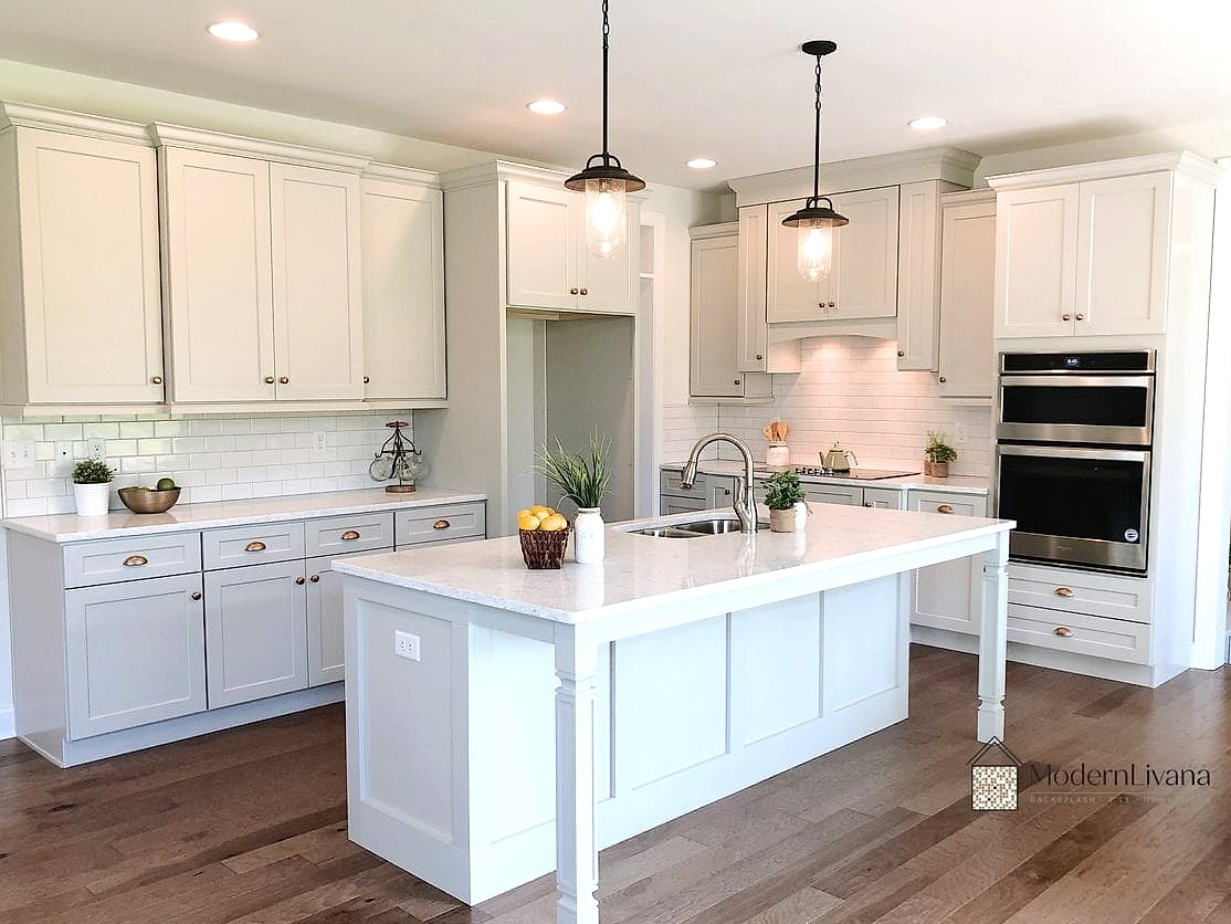 White Kitchen with Greenery Throughout