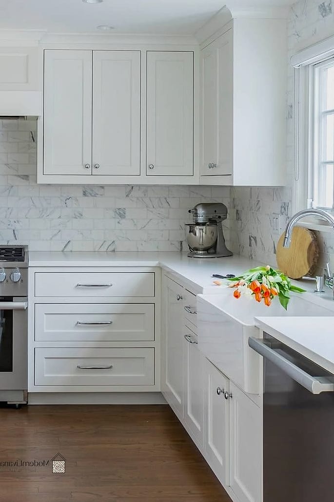 White Shaker Cabinets with a Wood Island